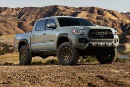 2023 Toyota Tacoma parked on dirt roads.